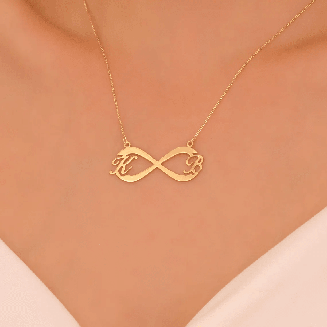 LUXARTO JEWELRY Ланче иработено со инфинити и букви K и B